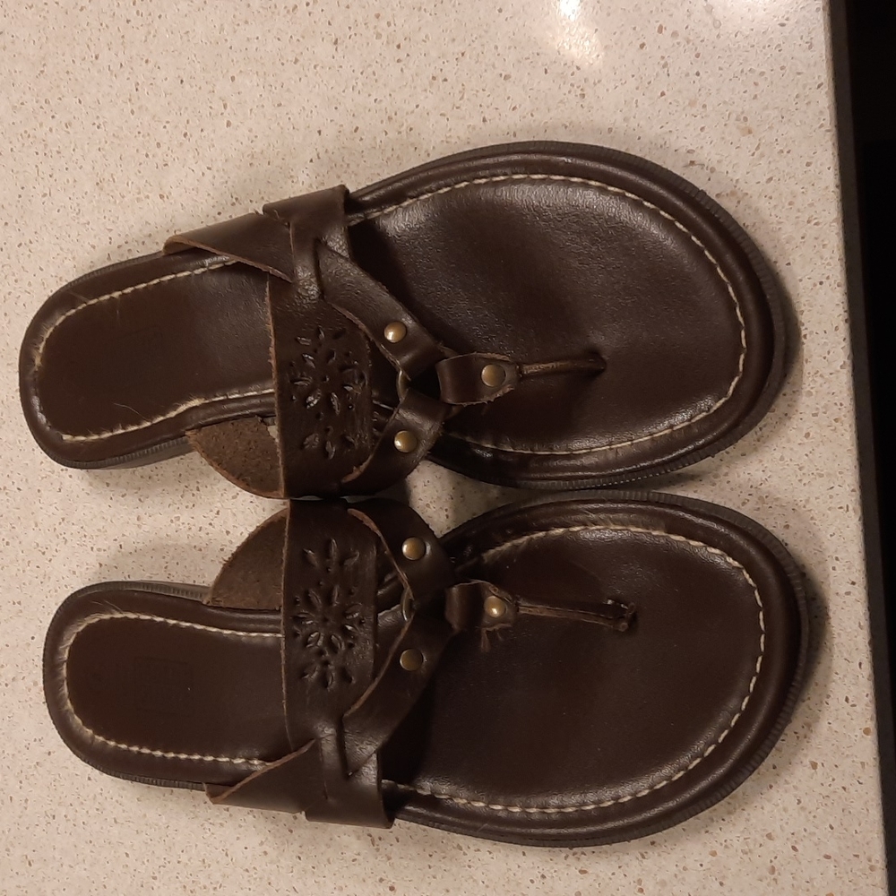 Brown leather flip flops